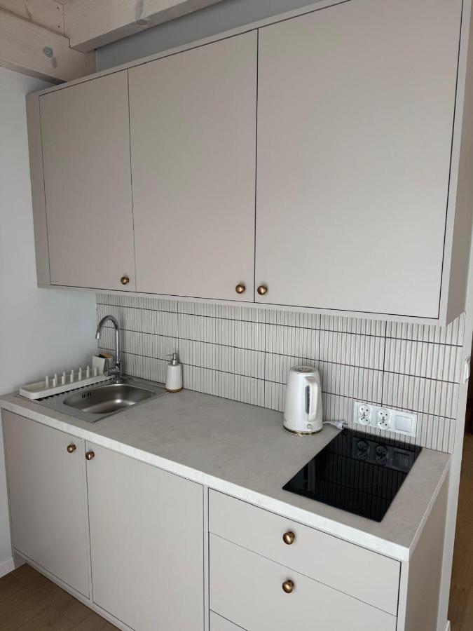White electric kettle sits on countertop at dog-friendly Port Rewa in Rewa.