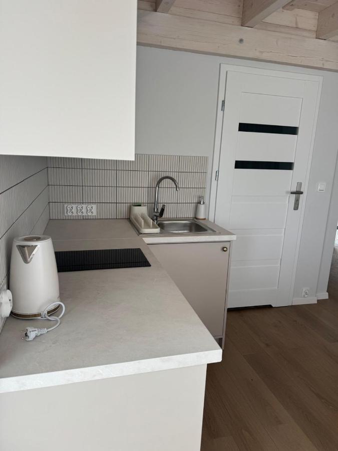 White electric kettle with coiled cord sits at pet-friendly Port Rewa in Rewa.