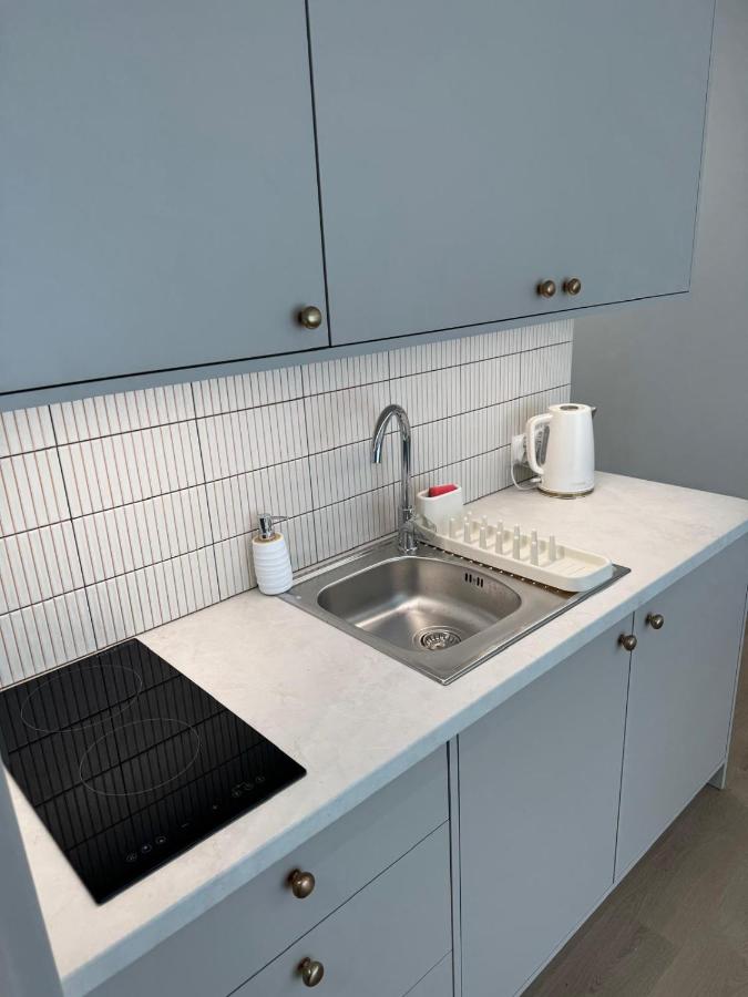 White electric kettle sits on gray countertop at pet-friendly Port Rewa in Rewa.