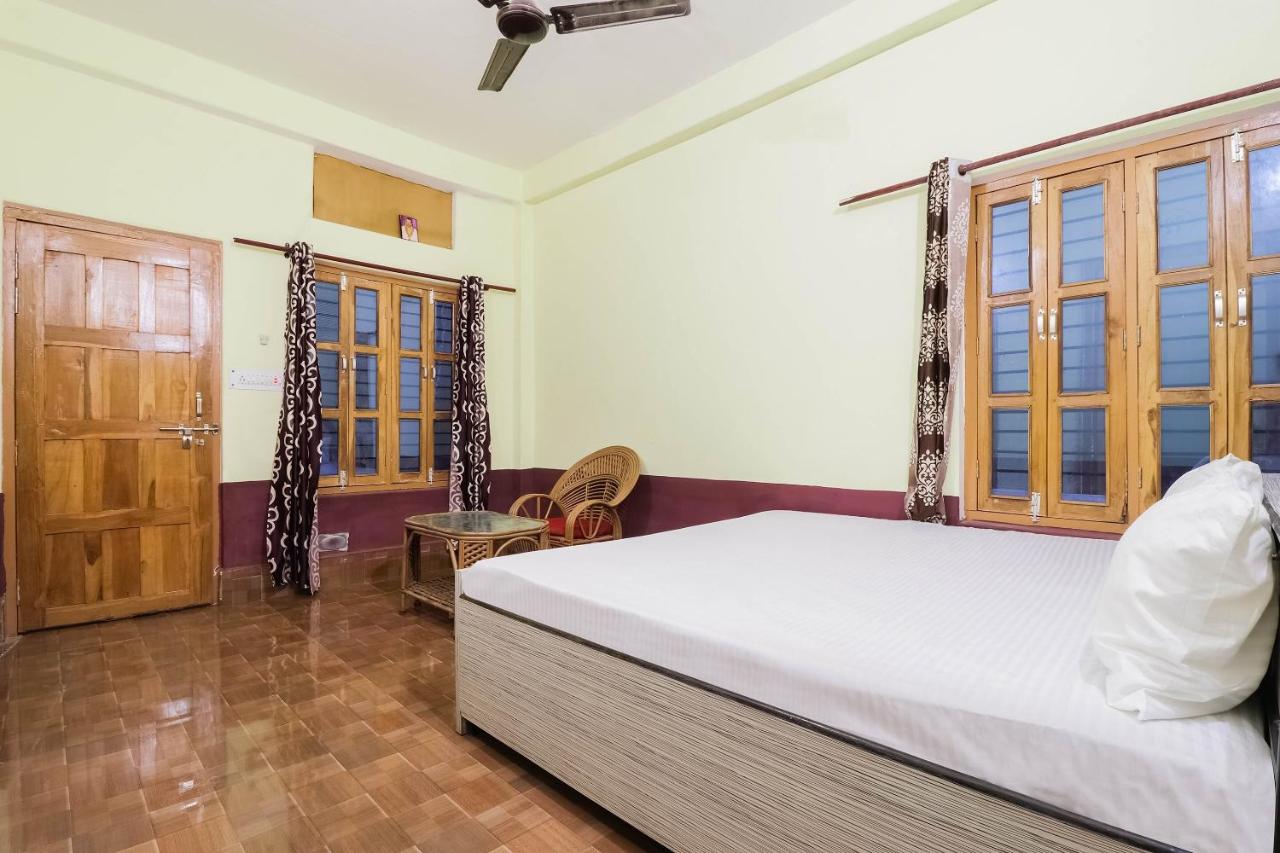 White mattress with white pillow rests at dog-friendly OYO Hotel 44676 Jyotish House in Ayodhya.