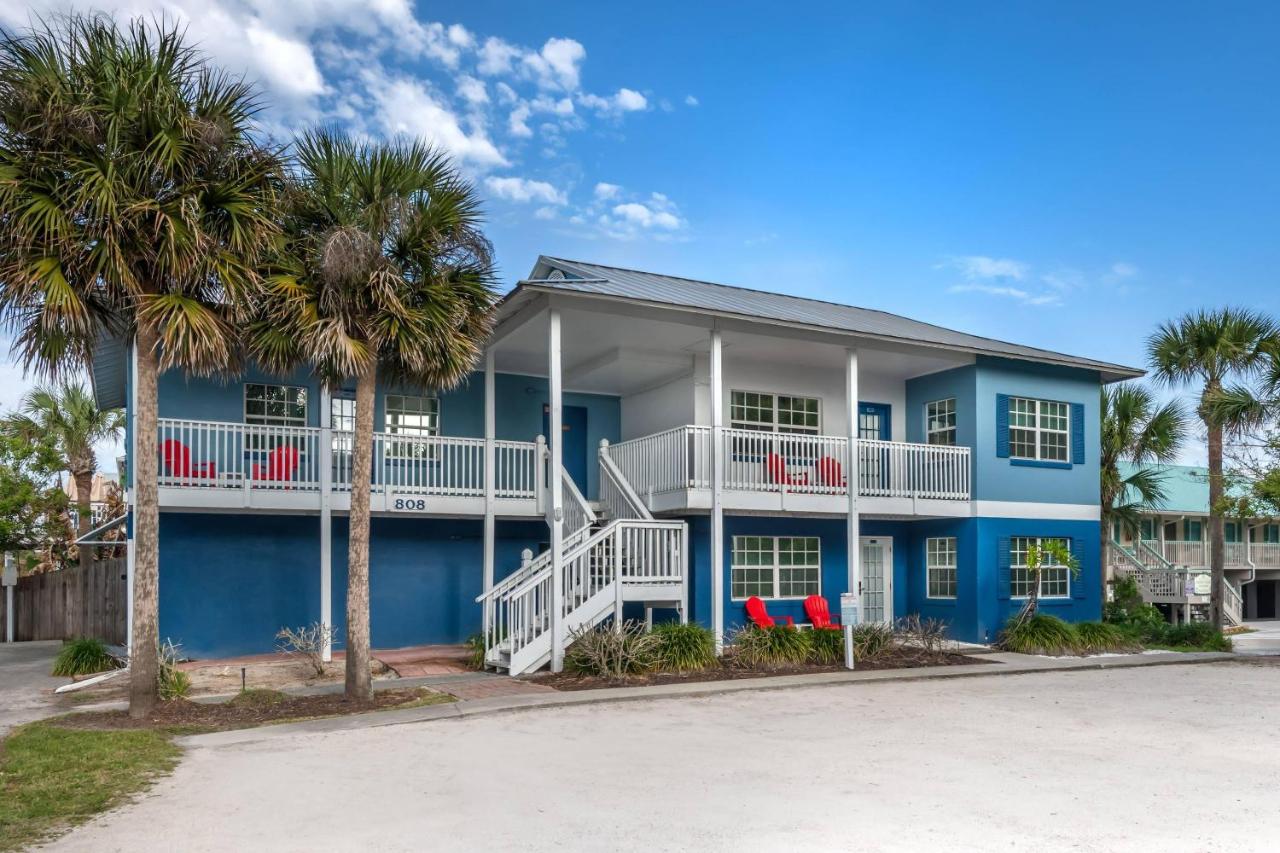 Blue building sits at pet-friendly Coconut Palms Beach Resort II an Ascend Collection Hotel in New Smyrna Beach, FL.