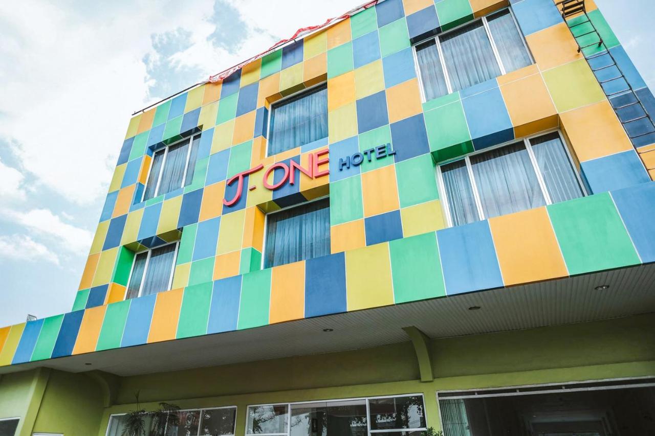 The multicolored tiled hotel facade stands at dog-friendly RedDoorz Premium at Hotel T-One Jambi in Tanjung Johor.