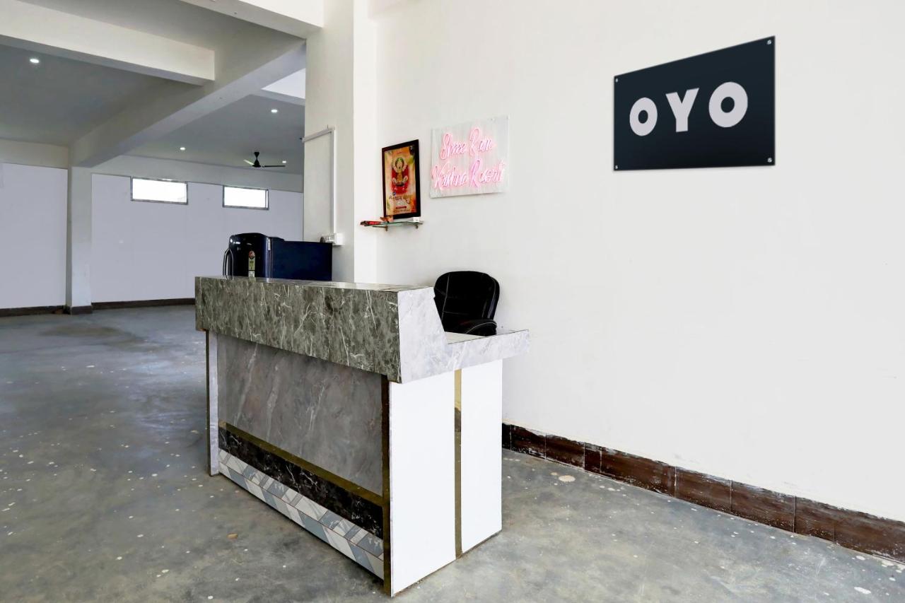 A gray marble reception desk stands at pet-friendly OYO Hotel Shri Ram Krishna and Resort in Akbarpur.