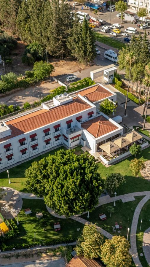 White hotel building with red awnings sits at dog-friendly 74 Otel in Antalya.