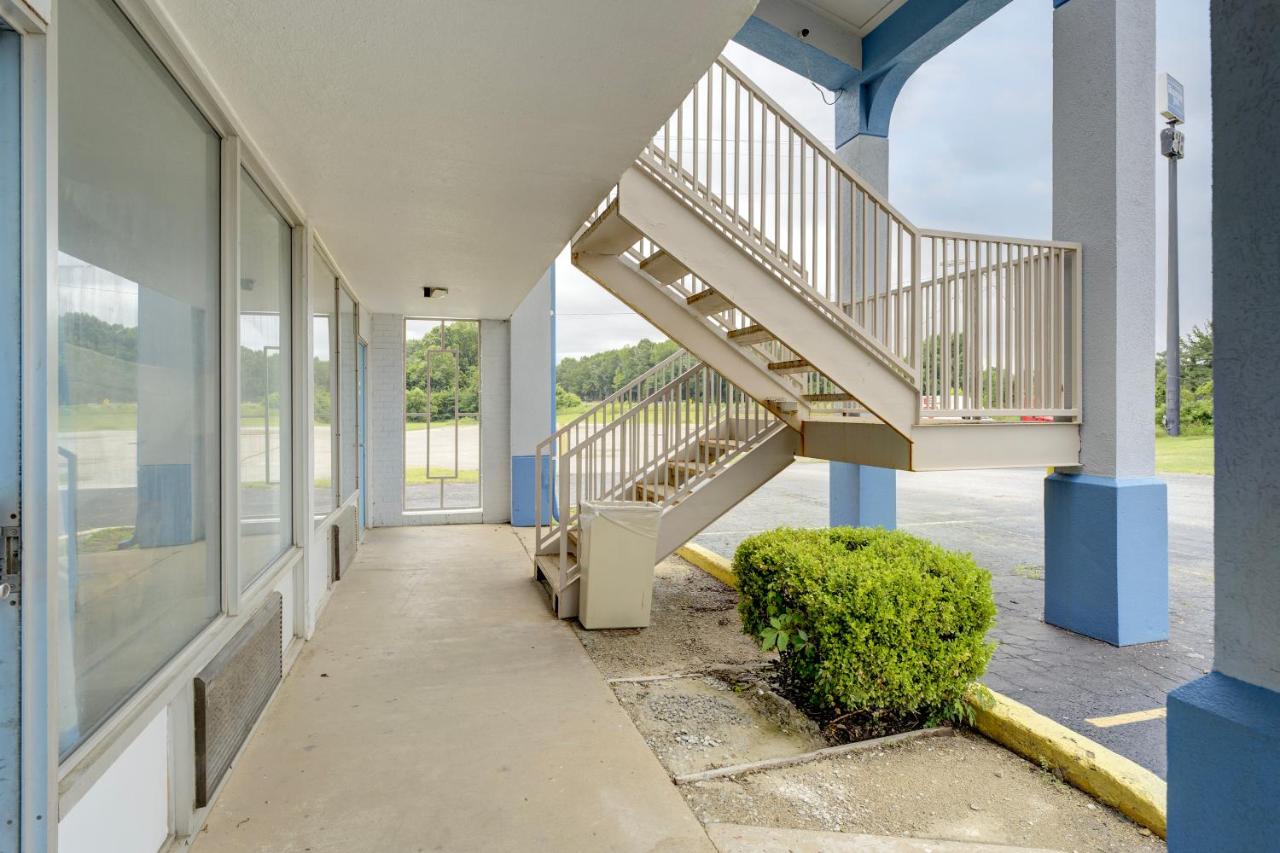 Beige metal exterior staircase stands at dog-friendly Ole South Inn Jackson I 40 TN in Denmark, TN.