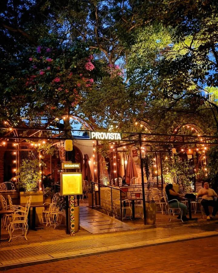 Two people in casual clothing sit at dog-friendly Sky Stays at Asuncion Cozy & Bright 1 BDR in Asunción.