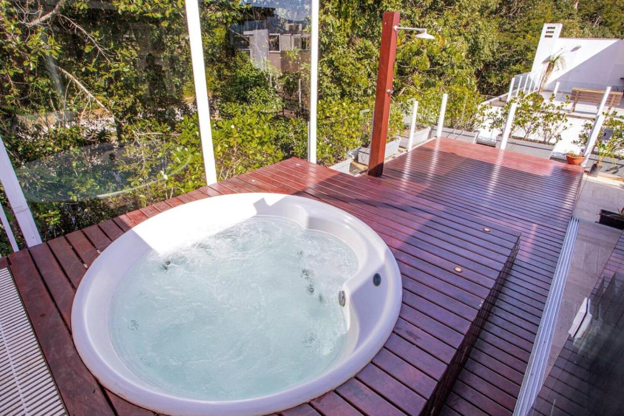 Casa com jacuzzi e rooftop - Wecare Hosting - B&B Bertioga