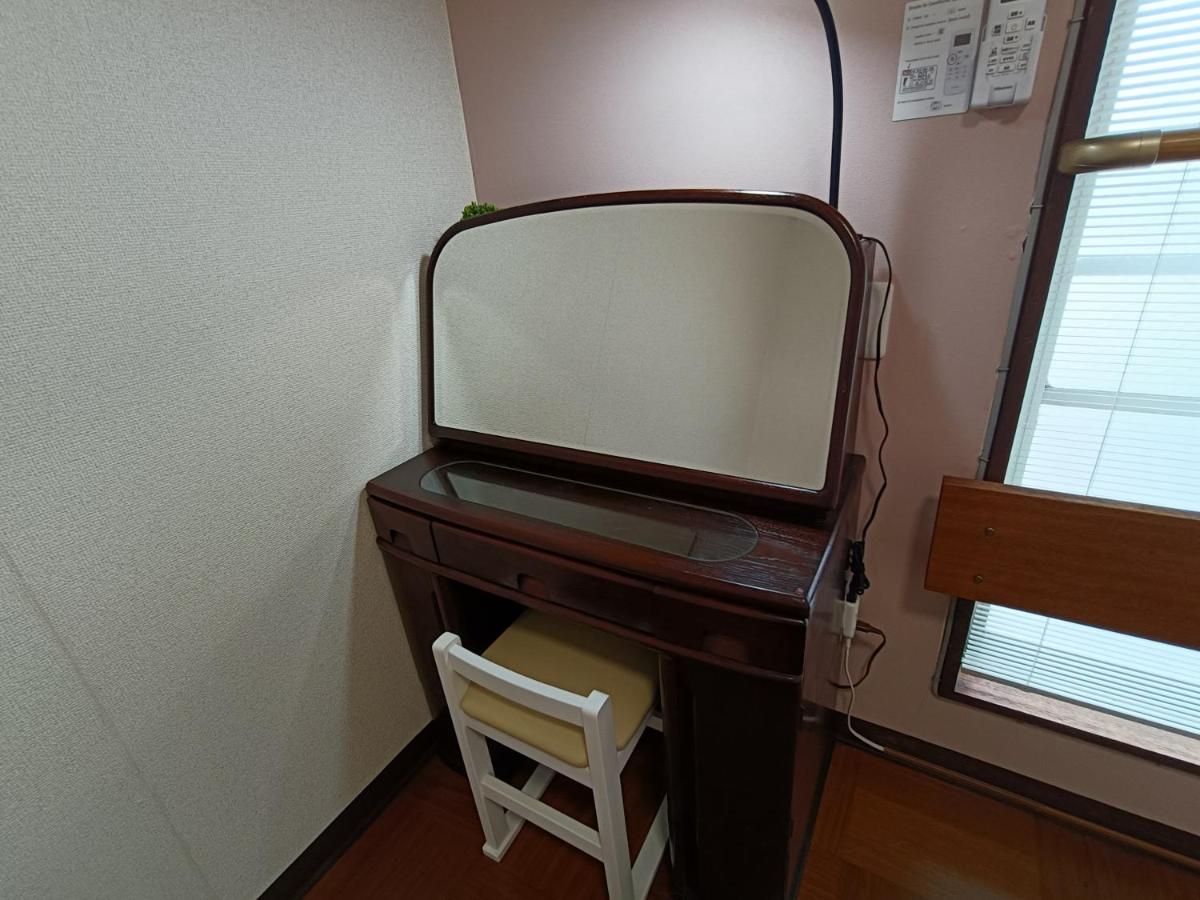 Camera Singola con Bagno in Comune
