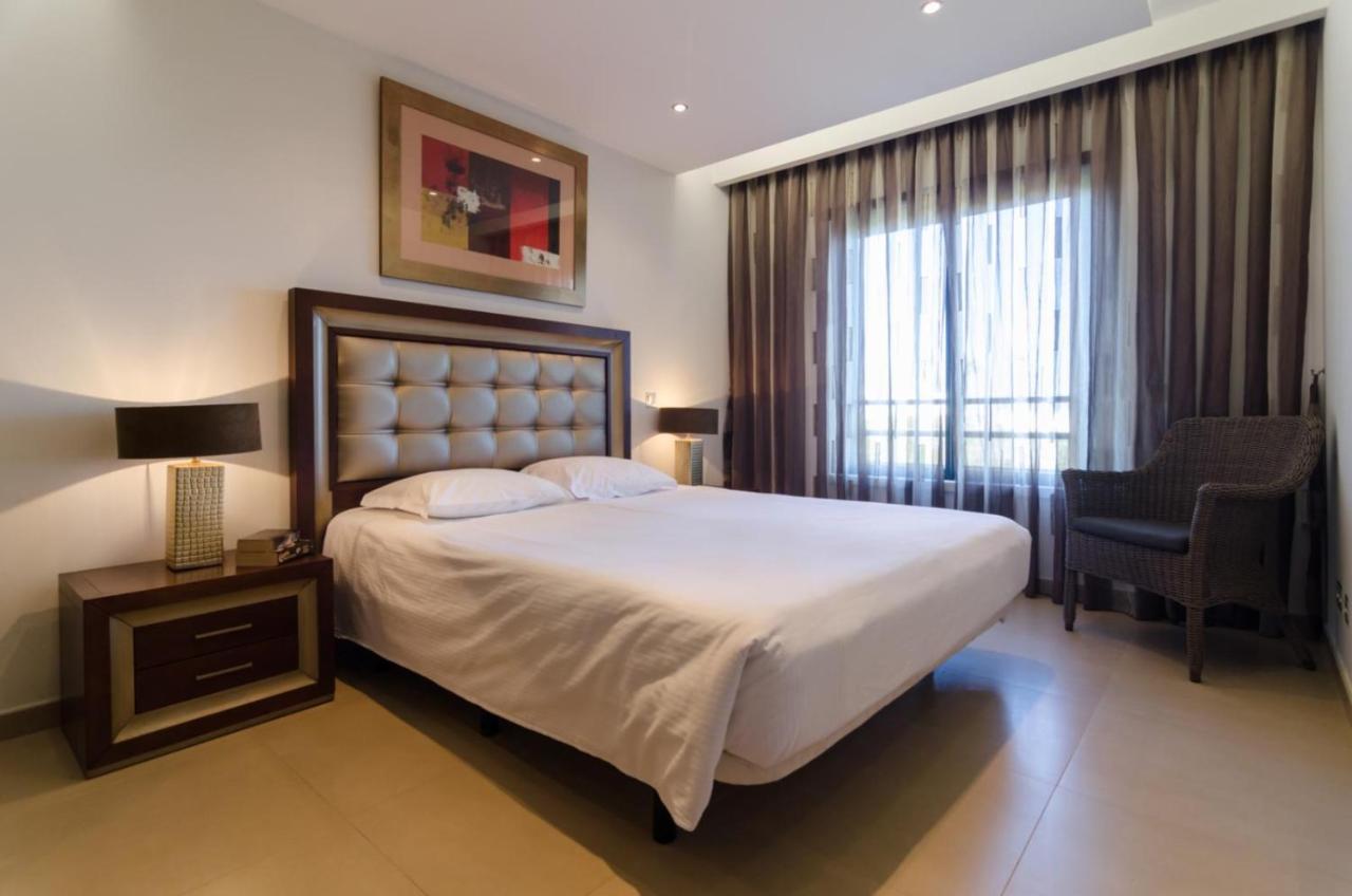 Two bedroom apartment with private garden, pool and sea view