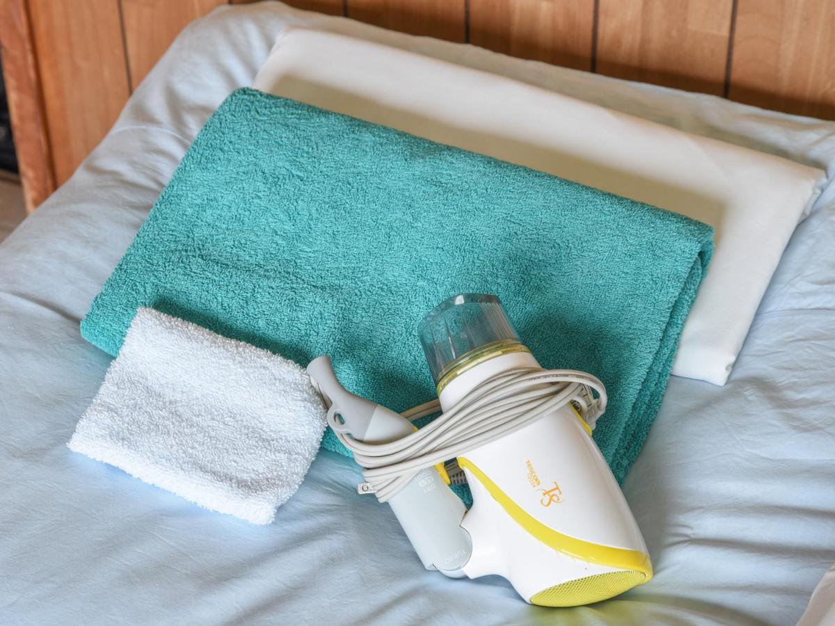 Camera Doppia in Stile Giapponese con Letti Singoli