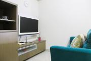 1BR with Extra Balcony The Oasis Cikarang Apartment By Travelio