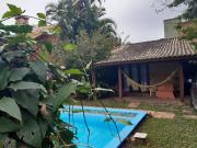 Casa Rústica praia da Ferrugem próximo praia com piscina compartilhada