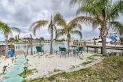 Sunset Beach Condo with Dock, Yard and Cornhole!