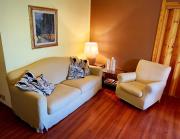 Elegante trilocale con garage, terrazzo e vista montagne