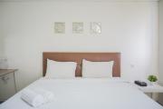 Minimalist Studio Bintaro Icon Apartment near British School By Travelio
