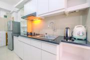 Furnished Green Pramuka 1BR Apartment with Modern Style and City View By Travelio