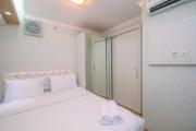 Cozy Stay 2BR Bassura City Apartment By Travelio