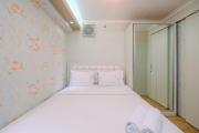 Cozy Stay 2BR Bassura City Apartment By Travelio