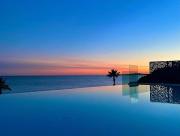 Appartement climatisé les pieds dans leau pour 6 personnes avec 1 suite parentale, 1 chambre double et 1 mini chambre Piscine sur le toit clim garage