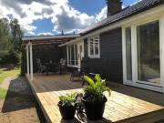 Modern lakeside cottage & boat near Isaberg