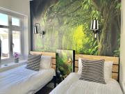 The Alice Apartment - by Coastline Retreats - Stunning Balcony Apartment with Sea Views - Alice in Wonderland Themed Secret Room - Luxury Copper Bath in Master Bedroom