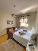 Casa aconchegante à 400m da Praia da Tartaruga - Ar condicionado - WIFI 450MB - Netflix - Cozinha Completa - Garagem