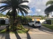 Private bedroom & den suite with shared pool & tropical garden