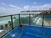 Na praia - Araça 407 Luxo - Lateral vista mar