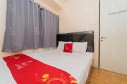 RedLiving Apartemen Tamansari Panoramic - Rasya Room