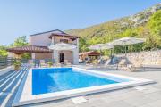 Traditional poolside villa surrounded by nature in Tribalj