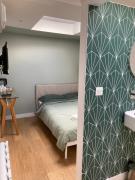 Central ensuite guest unit with air conditioning and free on street parking