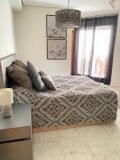 Elegant 2-Bedroom Apartment in Benidorm with Private Pool and Scenic Garden Views