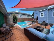 GrandCraftsman style home with pool and hot tub center toof New Orleans