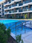 Resort em Porto de Galinhas- Flat Térreo Frente Piscinas- Muro Alto-B18