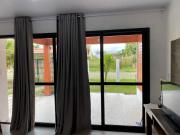 Casas de Veraneio em Torres com Terreno Compartilhado - Frontal