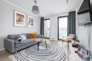 Subtle Grey Apartment with Furnished Balcony and Parking in Kraków by Renters