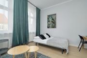 Stylish Grey Apartments with a City View in Poznań by Renters