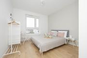 Bright Pastel Apartment with Desk for Remote Work, Balcony and Parking by Renters