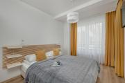 Exclusive and Modern Grey Apartment with Furnished Balcony in Kołobrzeg by Renters