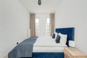 Dark Blue Two Bedroom Apartment in Wrocław with Parking and Air Conditioning by Renters