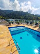 Apartamentos a 200m praia das Toninhas - Condomínio Vista Verde | Piscina na Cobertura com vista Espetacular