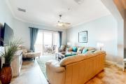 Spacious fourth-floor beachfront condo with pools, hot tub, fitness room