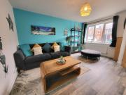 Seaside beach themed home with garden and driveway