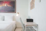 Minimalist Studio Room with City View at West Vista Apartment By Travelio
