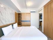 Homey and Spacious Studio Vasanta Innopark Apartment By Travelio