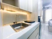 Elegant and Homey Studio at Amartha View Apartment By Travelio