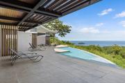 Luxurious Ultramodern Property with Private Suites, Infinity Pool, and Sweeping Ocean and Mountain Views