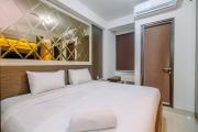 Warm and Minimalist Studio Room Transpark Cibubur Apartment By Travelio