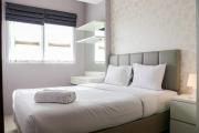 Minimalist and Warm 1BR Signature Park Grande Apartment By Travelio