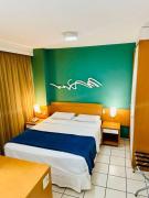 Praia do Canto Apart Hotel - Quarto sala e varanda